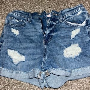 Ripped blue jean shorts